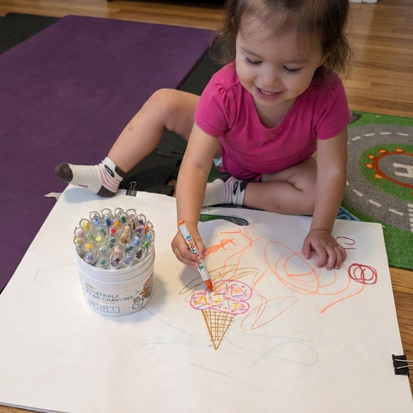 Kid coloring with TinyStroke crayons