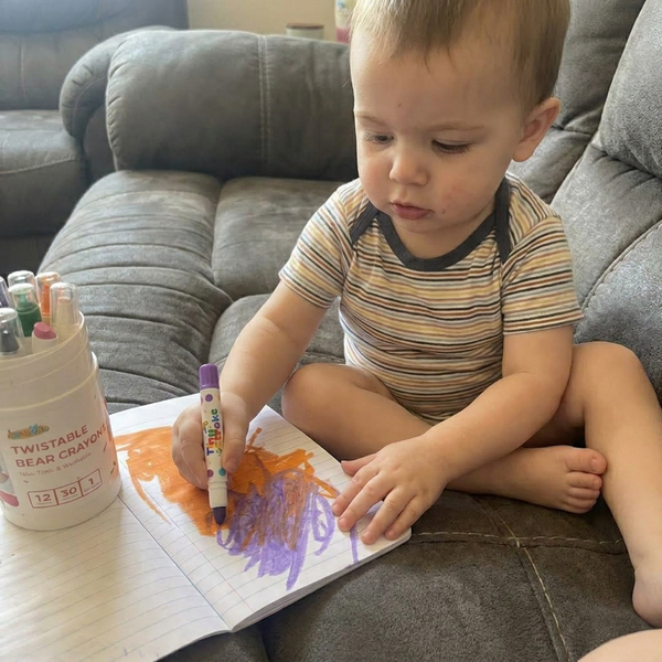 Kid coloring with TinyStroke crayons